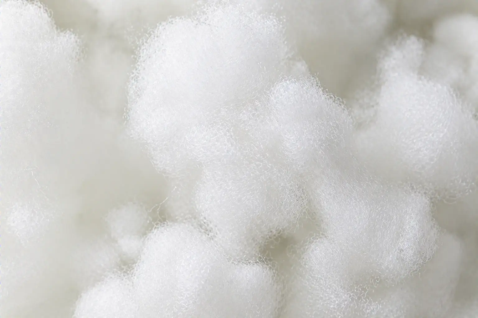Macro view of polyester fiber fill texture and density used in plush toy stuffing